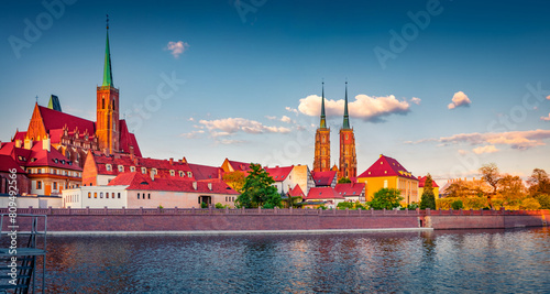Wonderful spring view of Tumski island with cathedral of St. John on Odra river. Sunny morning cityscape of Wroclaw, Poland, Europe. Traveling concept background..