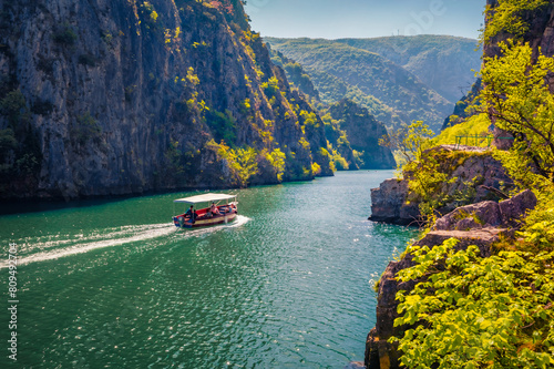 Wonderful spring view of Matka Canyon with small cruise boat. Sunny morning scene of North Macedonia, Europe. Traveling concept background. © Andrew Mayovskyy