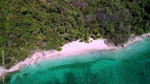 Playa Quesera beach with white sand and tropical palm trees at peninsula of Nicoya, Puntarenas photo
