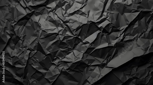 Black crumpled paper texture. Crumpled black paper abstract shape background with space paper for text photo
