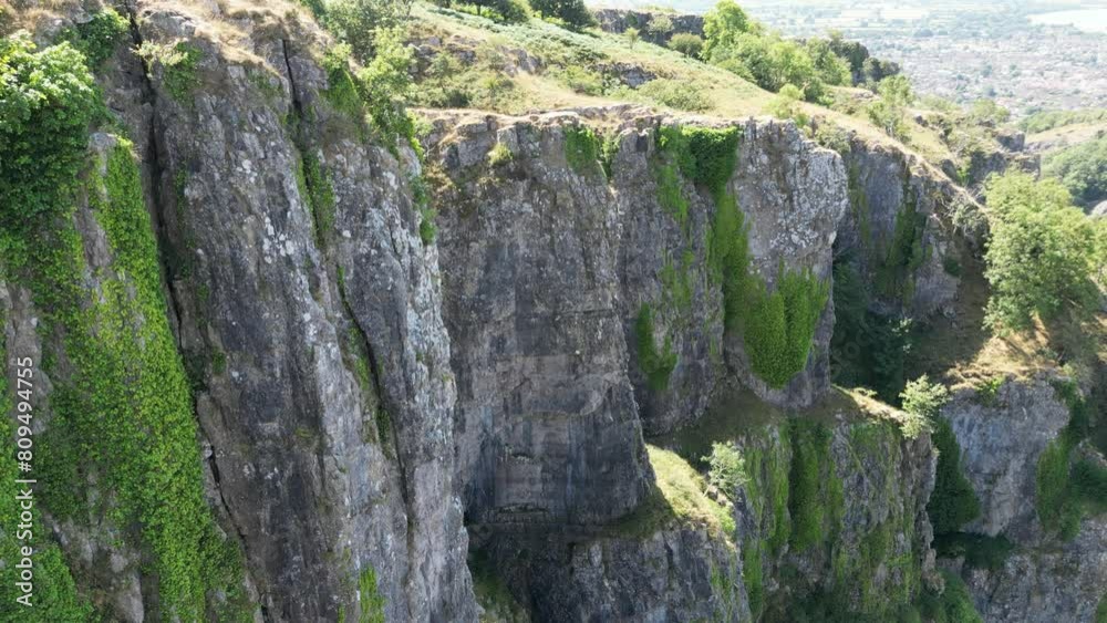 limestone mountain with green-covered parts of Cheddar Gorge in a Ravine in the Mendip Hills limestone mountain with green-covered parts of Cheddar Gorge in a Ravine in the Mendip Hills