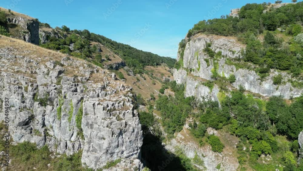 limestone mountain with green-covered parts of Cheddar Gorge in a Ravine in the Mendip Hills limestone mountain with green-covered parts of Cheddar Gorge in a Ravine in the Mendip Hills