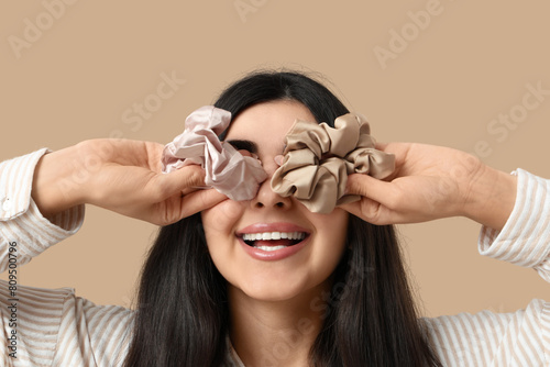 Happy woman with silk scrun...