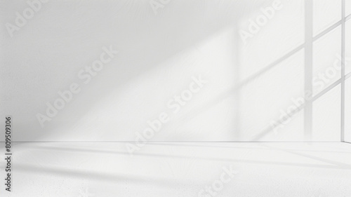 empty room with white walls with window shadow
