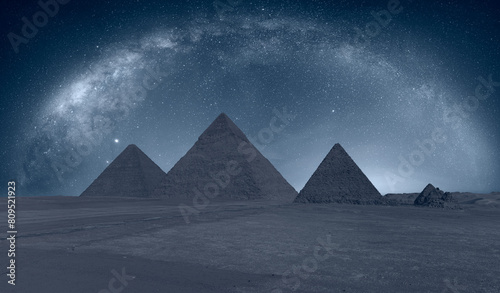 The Milky Way rises over the Pyramids in Giza, Egypt © muratart