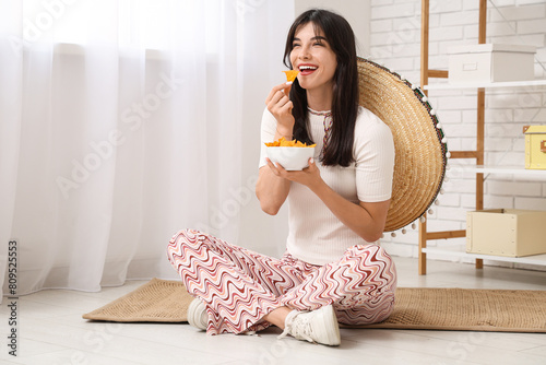 Young woman with sombrero a...