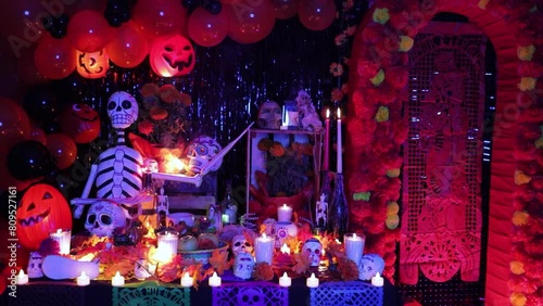 Day of the Dead altar offerings with blue and red lights, establisher photo