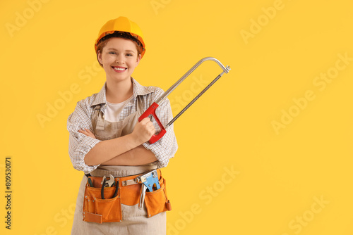 Young female carpenter with...