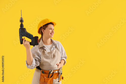 Young female carpenter with...