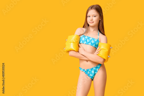 Cute little girl in swimsui...
