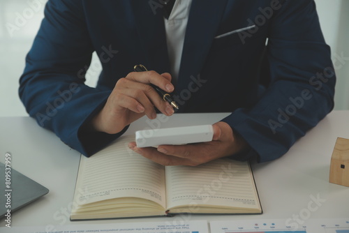 Canvastavla Businessmen holding pens, signing home titles with insurance, care about real estate services and the idea of real estate agents offering interest in installments to their customers