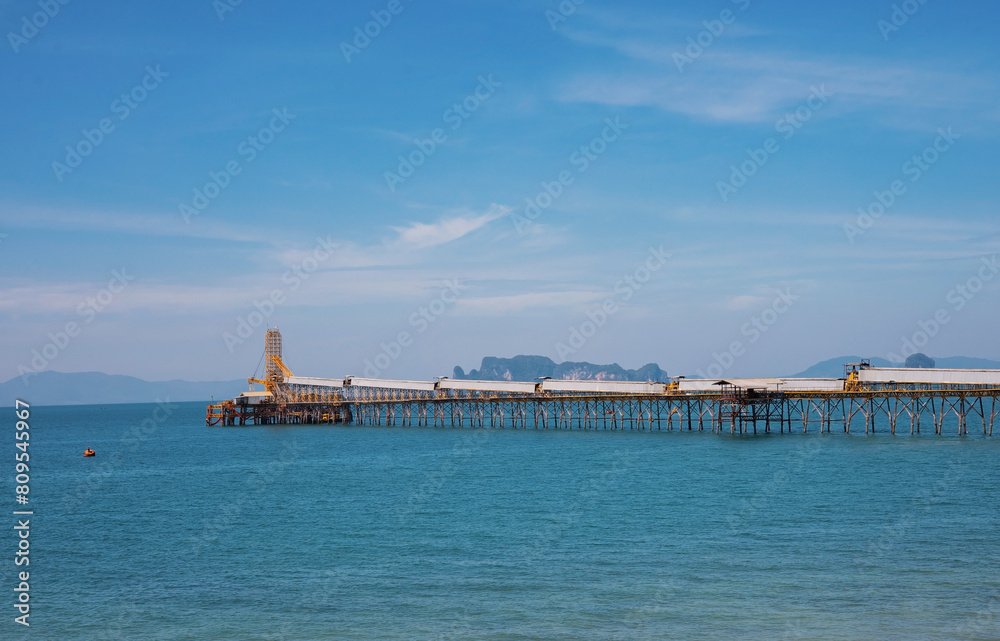 Mineral walking bridge extending into the sea