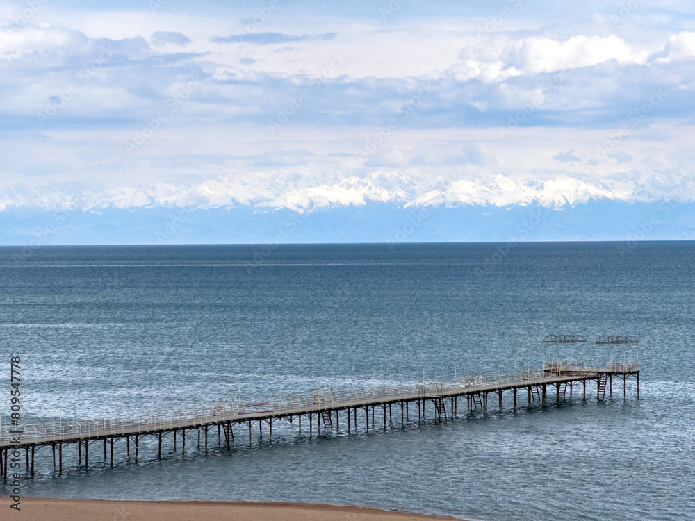 Sunny summer day on the lake. Mountains and sea. Kyrgyzstan, Lake Issyk-Kul