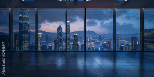 Office courtyard we see through the window the towering buildings and lights, at night