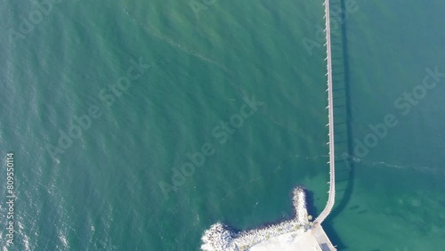 Richfield Pier - Causeway Connecting Rincon Island To Mainland In Ventura County, California. aerial topdown shot photo