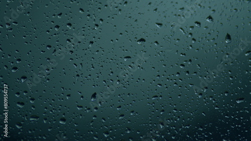 Water Drops On Glass Background. Reflected Light. Macro view.