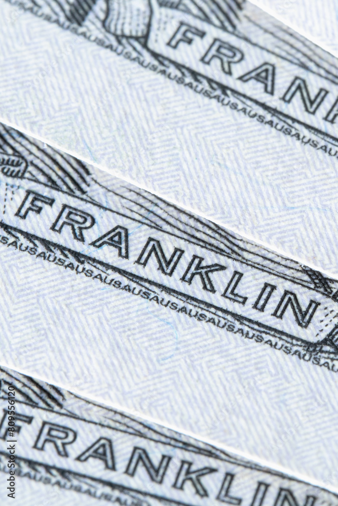 Macro image with Franklin description on the one hundred US Dollar bill. Vertical image. Macro image with Franklin description on the one hundred US Dollar bill. Vertical image.