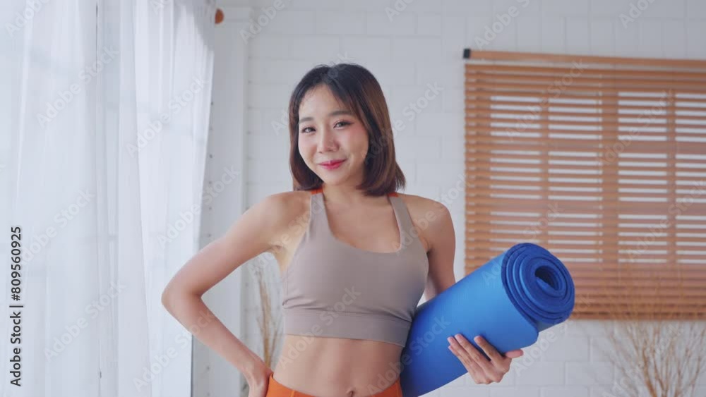 Portrait of Asian young sportswoman doing yoga pilates workout at home. Portrait of Asian young sportswoman doing yoga pilates workout at home.