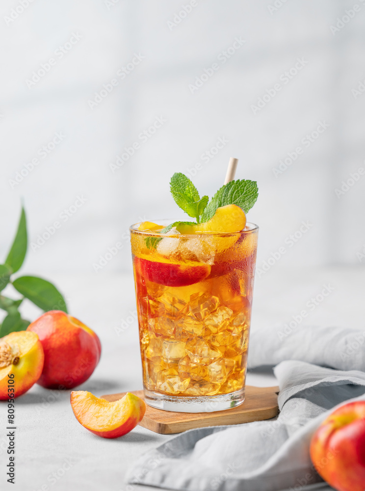 Refreshing peach iced mint tea. The concept of a healthy homemade cold summer drink Refreshing peach iced mint tea. The concept of a healthy homemade cold summer drink
