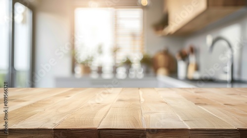 Empty beautiful wood table top counter and blur bokeh modern kitchen interior background photo