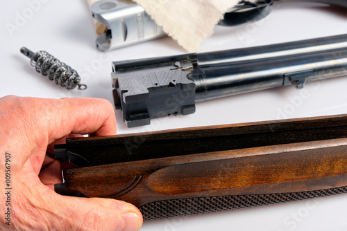 The forend of a hunting double-barreled shotgun is made of walnut; it must be lubricated with linseed oil photo