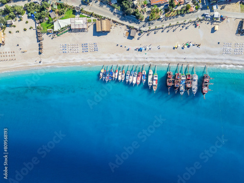 Slika na platnu Oludeniz beach and boats waiting on the beach enjoy the turquoise sea