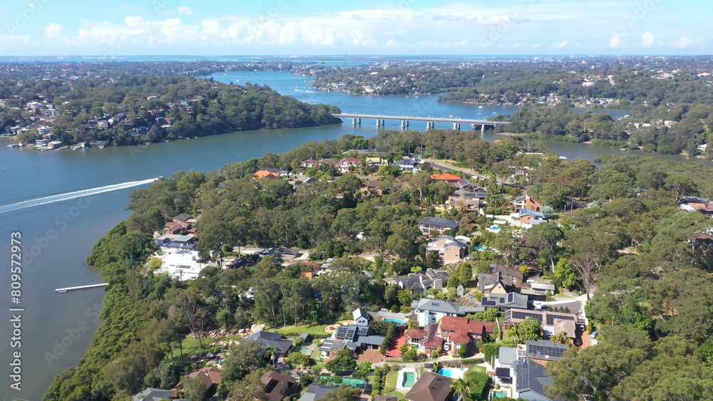 Aerial drone view above Illawong in the Sutherland Shire, South Sydney, NSW Australia on a sunny day in April 2024 looking toward Como Bridge 