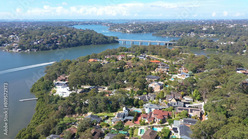 Aerial drone view above Illawong in the Sutherland Shire, South Sydney, NSW Australia on a sunny day in April 2024 looking toward Como Bridge  © Steve