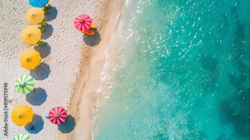 sun - kissed beach getaway with a variety of colorful umbrellas, including blue, yellow, and open ones, casting shadows on the sand