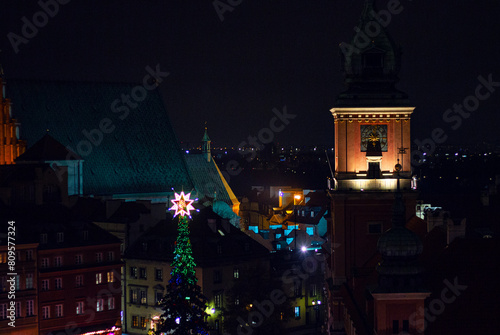 View from the Taras Widokowy observation deck on Royal Castle and Christmas tree in the Old Town (Stare Miasto) of Warsaw during winter holidays, Poland