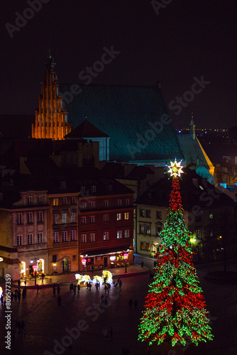 View from the Taras Widokowy observation deck on Royal Castle, Christmas tree and Basilica of St. John the Baptist in the Old Town (Stare Miasto) of Warsaw during winter holidays, Poland