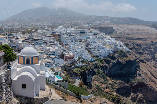 Santorini, Greece, May 3, 2024. Landscape of the capital Fira with the Church of Saint Stylianos photo