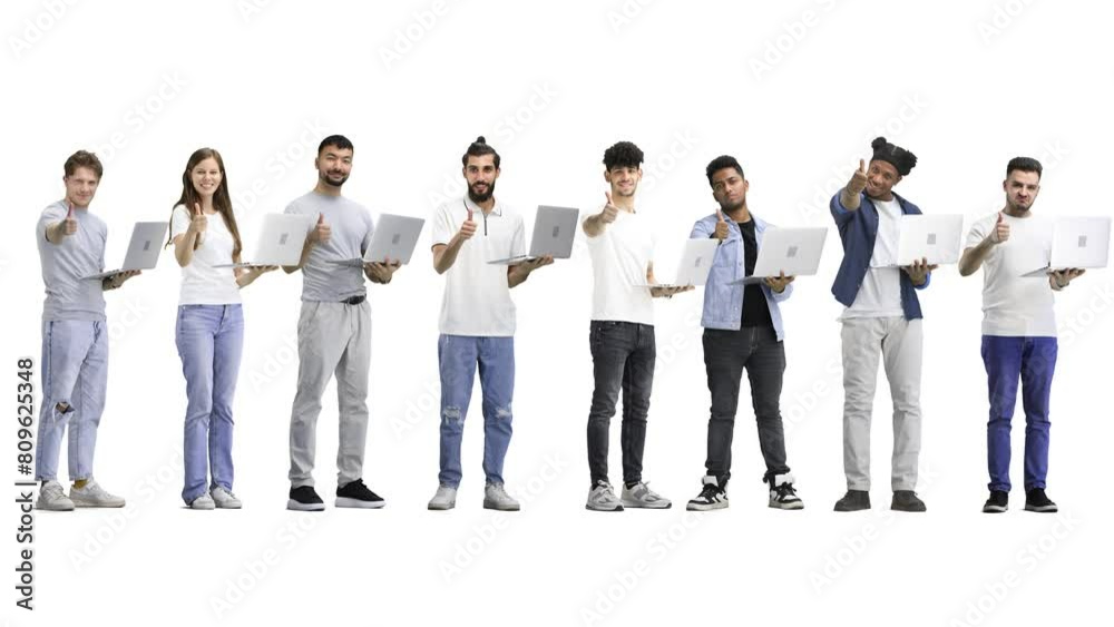 A group of people, full-length, on a white background, show a thumbs up with a laptop A group of people, full-length, on a white background, show a thumbs up with a laptop