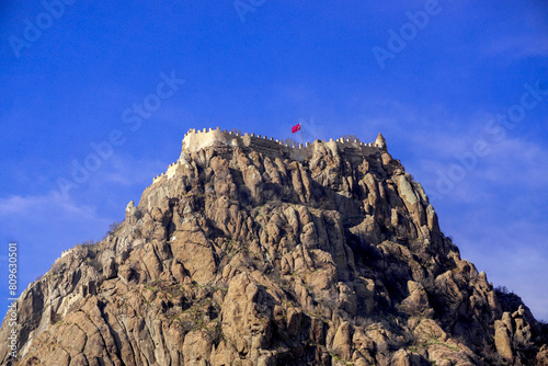 4 February 2024 Afyonkarahisar Turkey. Afyonkarahisar castle and Afyon cityscape from castle on a cloudy winter day photo