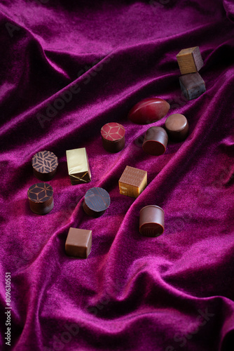 cchocolate candy on purple velvet  textile