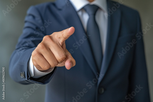 Businessman pointing finger in front side