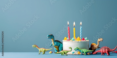 Fototapeta Naklejka Na Ścianę i Meble -  Imaginative dinosaur-themed birthday cake adorned with vibrant candles and toy dinosaurs, perfect for a child's prehistoric celebration