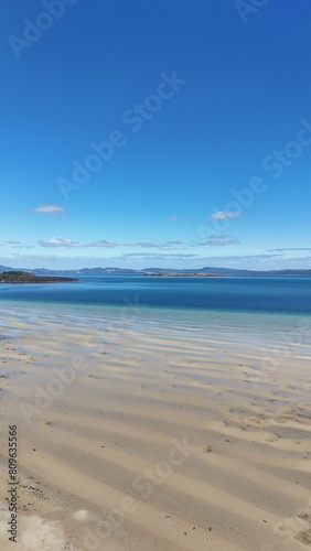 Picturesque beach landscape with a sandy coastline and clear water in Tasmania  Australia.