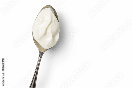 a spoon with a spoonful of yogurt on it