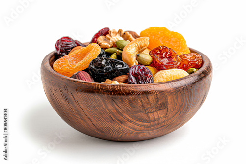 a wooden bowl filled with dried fruit and nuts