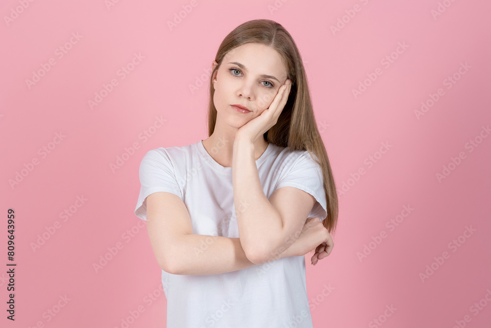 Portrait of attractive caucasian young blonde woman in casual white t-shirt bored sad tired isolated on pink studio background. Depressed, deadline, exhausted, unhappy. Portrait of attractive caucasian young blonde woman in casual white t-shirt bored sad tired isolated on pink studio background. Depressed, deadline, exhausted, unhappy.