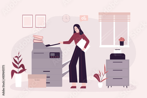Woman office worker uses copy machine to scan document. Female employee stands near professional copy machine or printer doing paper work. Office room interior.