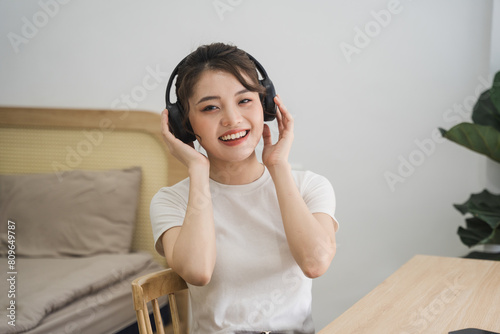 Portrait of beautiful young Asian girl at home