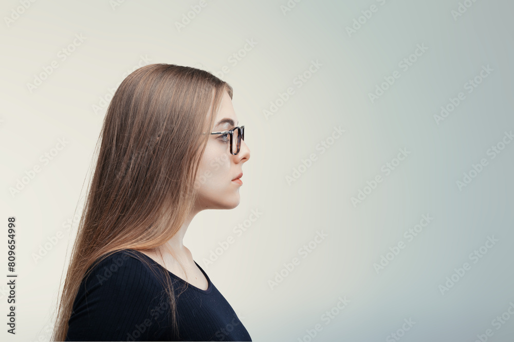 Fototapeta premium Spectacled profile suggests scholarly thoughts, calm demeanor