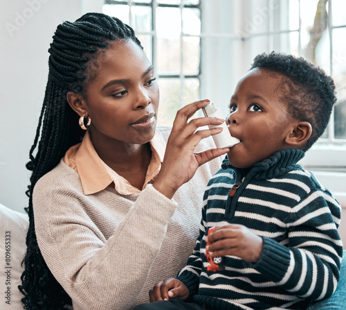 Black family, mother or inhaler for kid with asthma in home living room with chest pain or emergency. Anxiety, oxygen or mom with sick baby, boy or child with panic attack, allergy and breathing pump photo
