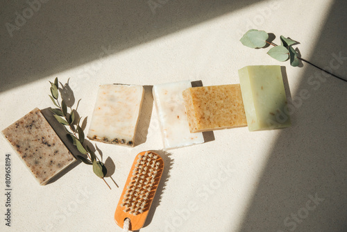 Handmade soap from natural ingredients, various herbs. Concept of sustainable use, bath products. Top view photo