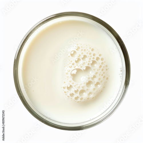 a glass of milk from a top down view. Make the milk look creamy and delicious.