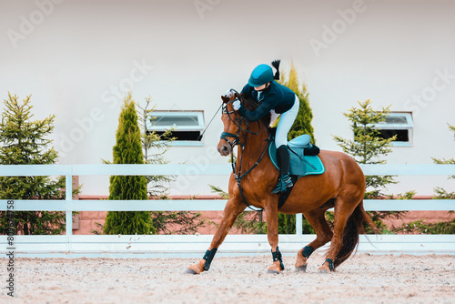 Falling from a horse to a speed and hardiness competition. Riders elimination on show jumping. Jumping fail photo