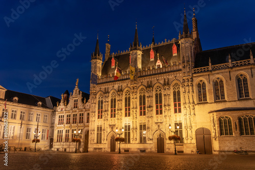 De Burg square and the city hall of the beautiful city of Bruges in Belgium at night, with its historic facades. © JoseLuis