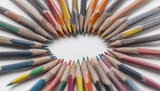 Colored pencils placed symmetrically next to each other, isolated white background
